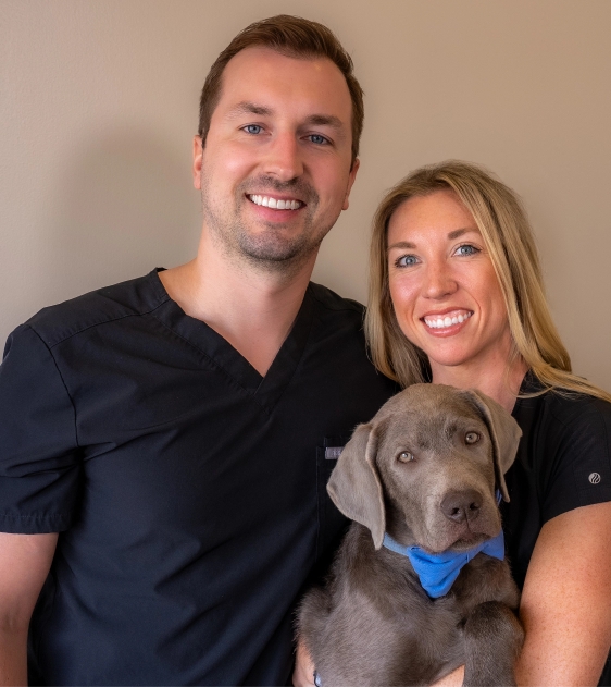 Mesquite Dental Suite | Dr. Josee Jansen and Dr. Seth Hintze posing with a dog